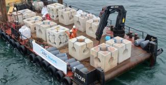 reef cubes being deployed around an aquaculture site